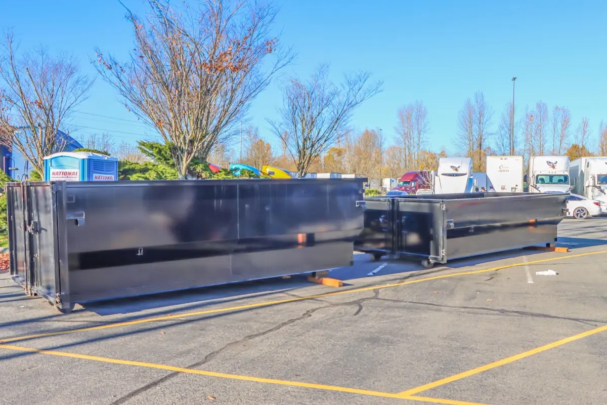 Professional dumpster rental service with roll-off container on residential driveway in La Vergne